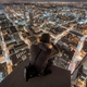 Illustration for article titled People tip toeing on top of buildings over cities will always be scary